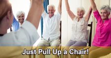 Seniors using a kitchen chair to do seated exercises